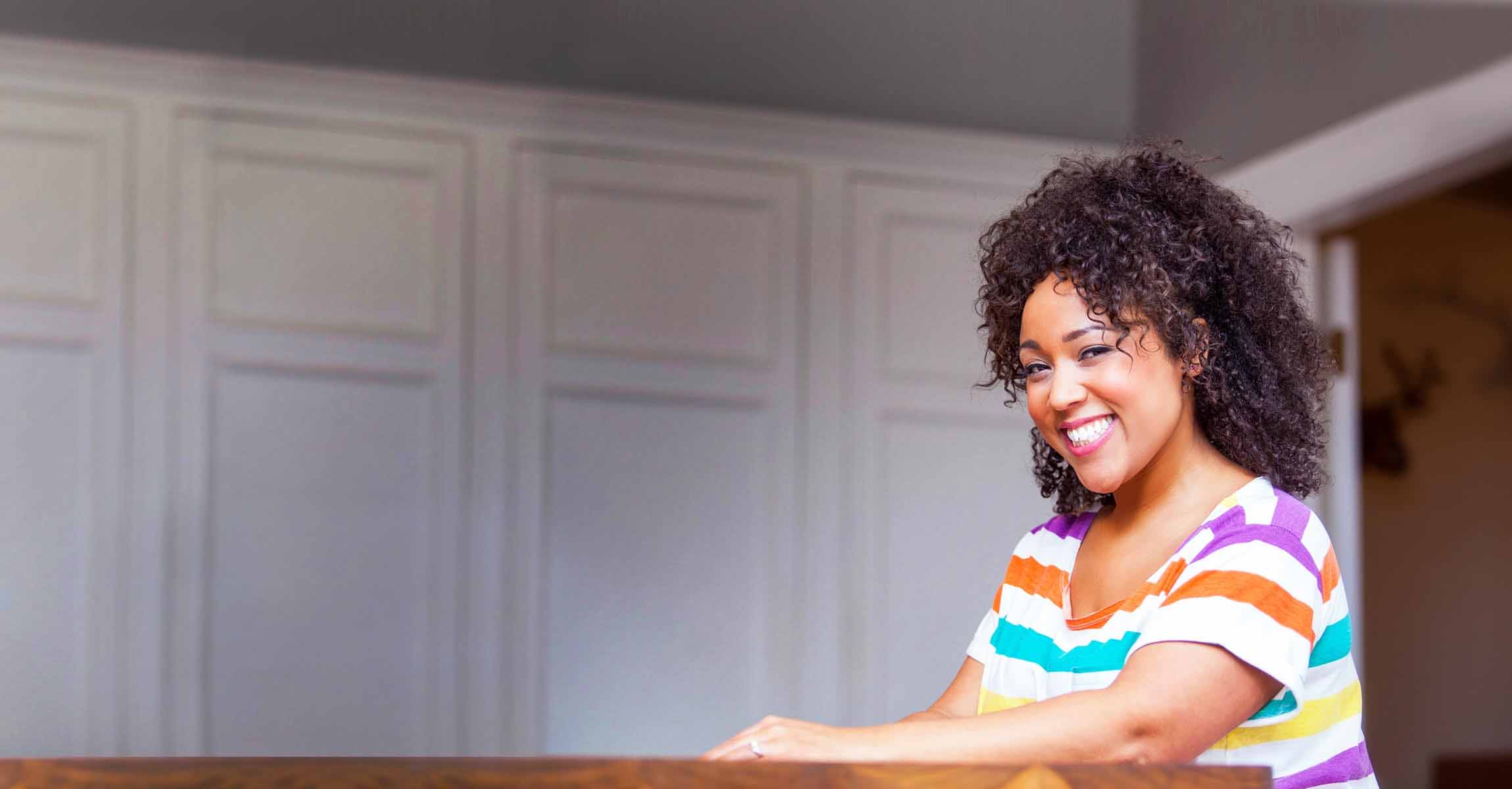 smiling woman in striped top