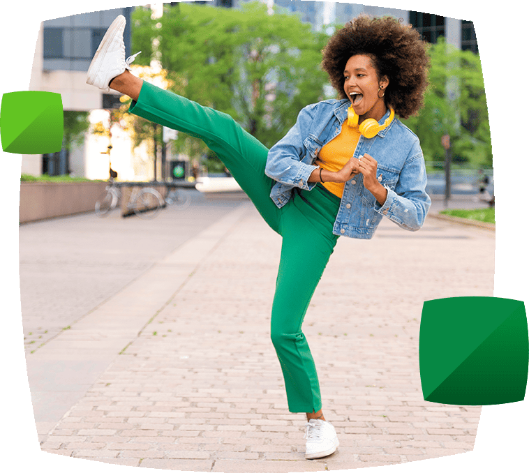 Women in green trousers doing high kick