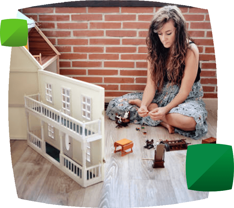Woman with dolls house