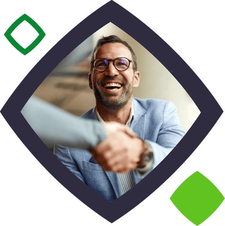 smiling man shaking someone's hand