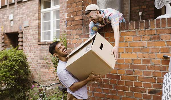 people passing a moving box